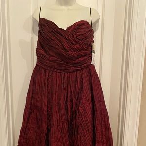 Beautiful formal dress in a red/burgundy color.